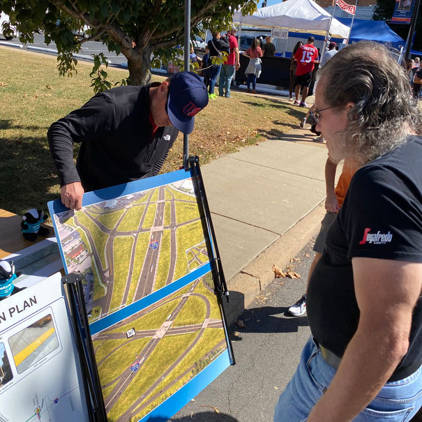 Florissant Fall Festival attendees view project plans